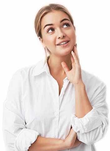 Close-up portrait of pleased woman with pure skin, dark eyes and sincere smile wearing white shirt posing against studio wall. Dreamy woman thinking about pleasant things, looking upwards. Close-up portrait of pleased woman with pure skin, dark eyes and sincere smile wearing white shirt posing against studio wall. Dreamy woman thinking about pleasant things, touching her face, looking upwards.